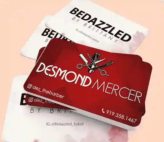 Stack of barbershop and bedazzled business cards